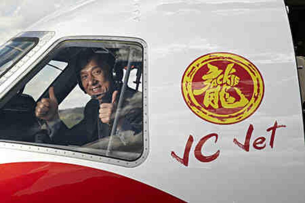 Jackie Chan in Embraer Legacy 650 cocpit