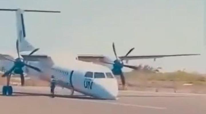 Lądowanie ze złożonym podwoziem Dash 8-400 United Nation, fot. flightglobal