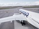 Samolot Finnair na płycie lotniska - widok z góry z tyłu na pas startowy (fot. Finnair)