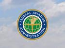 Federalna Administracja Lotnictwa (FAA) - logo na tle nieba z chmurami (fot. FAA)